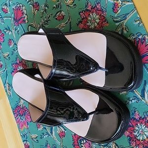 Removing 6/1. Taryn Rose Tonya Black Patent Slide Sandals.